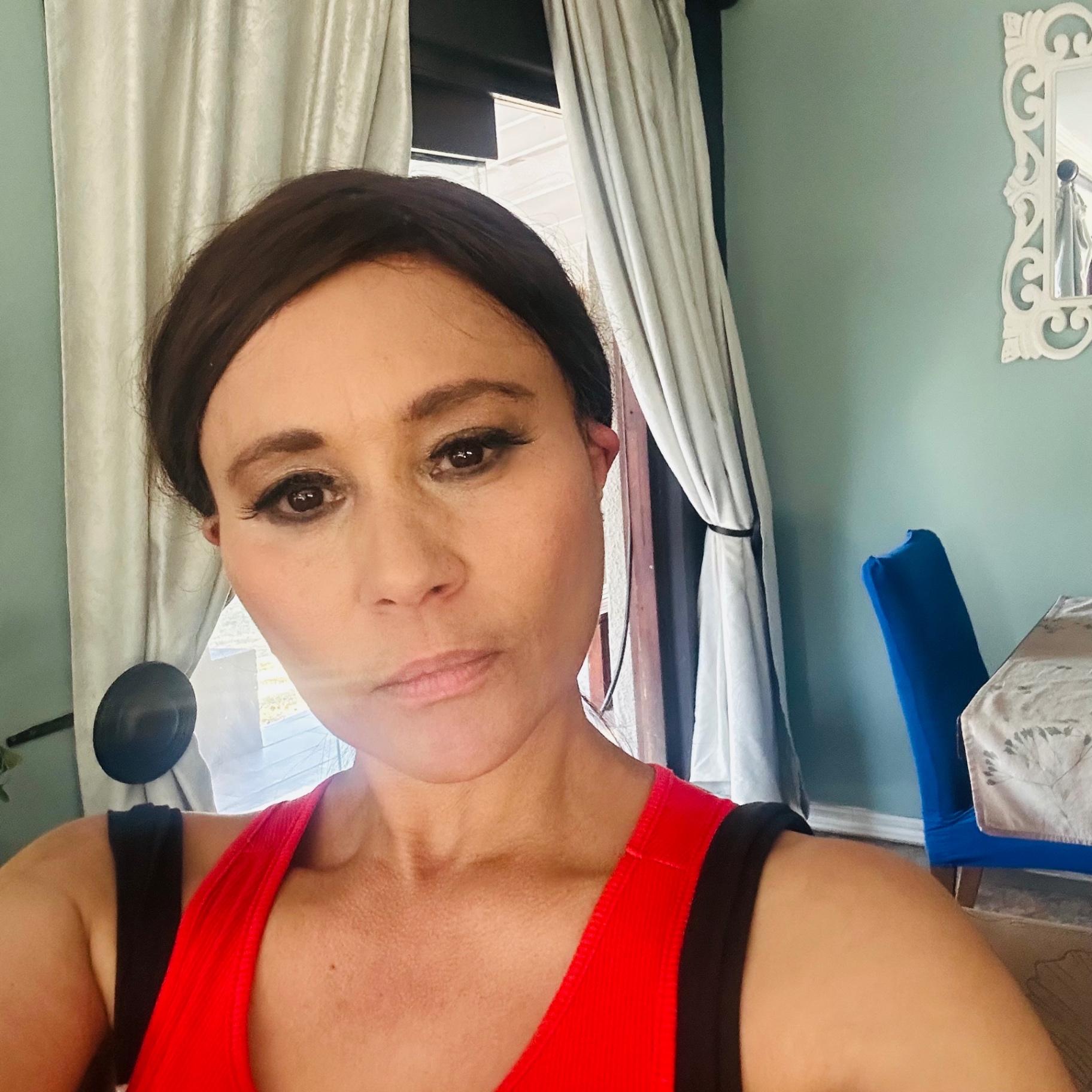 Close portrait of Cass with soft, fresh-faced Sunday makeup, winged liner, natural lip